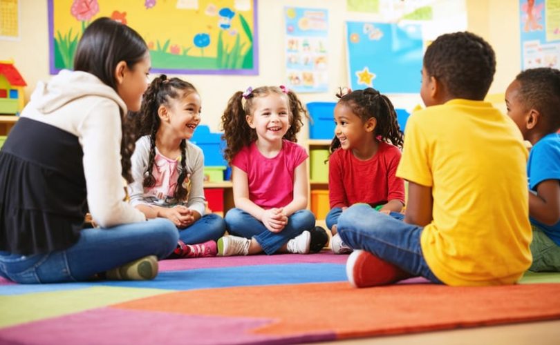 A group of diverse middle school children happily engaging in conversation and play in a cozy room, highlighting the theme of friendship and social growth.