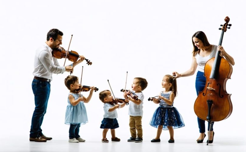 An illustration of a family representing an orchestra, with each member playing a different instrument symbolizing the functions of emotional security, social development, physical care, educational support, and values, showcasing the harmony needed for child mental health.