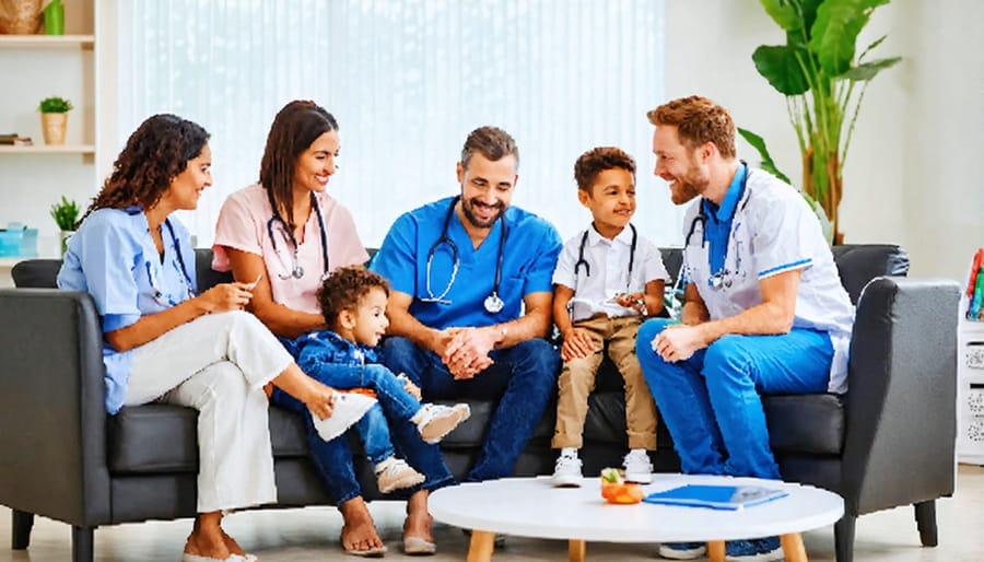 Healthcare professionals meeting with families in a warm, inclusive environment featuring comfortable seating and colorful artwork